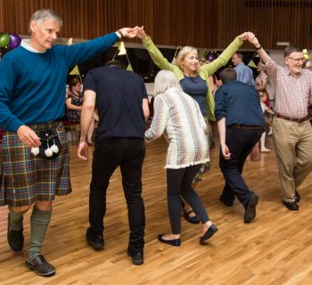 Dancing at celebration in George Young Hall, LifeCare Centre Edinburgh